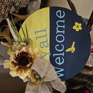 Yellow and Black Welcome Sign with Floral Accents